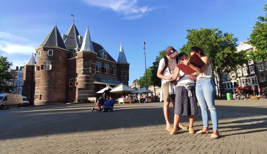 Amsterdam: Treasure Hunt Walking Tour "A Secret Sender" - Nieuwmarkt Square and the first clues