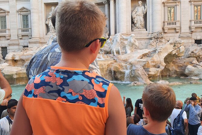 Trevi Pantheon and Spanish Steps Treasure Hunt for Kids & Families in Rome - Tossing a coin at the Trevi Fountain